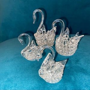 Set of four spun glass swans.